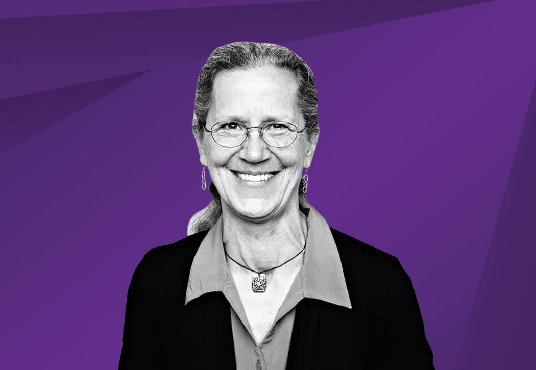 woman smiling with purple back ground