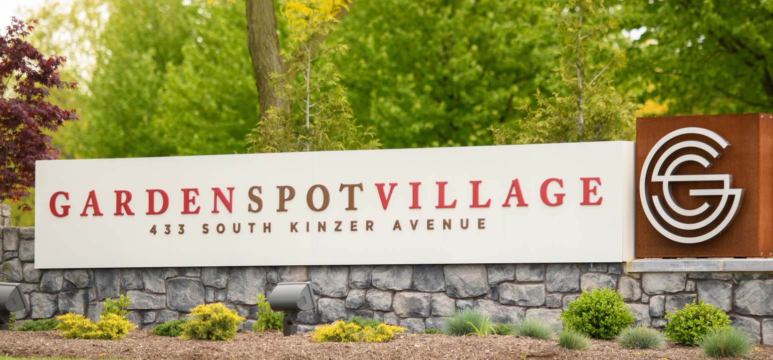 a sign for gardenspot village 433 south kinzer avenue